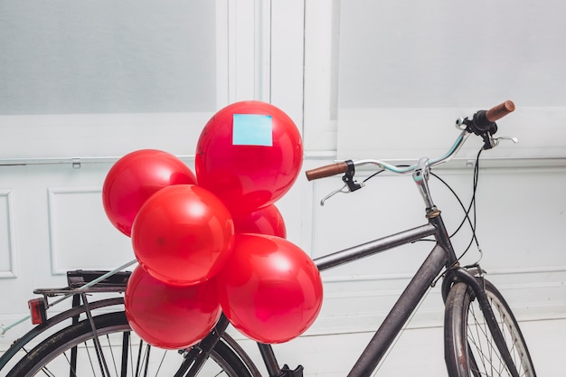 Red balloons with sticker fixed to cycle 