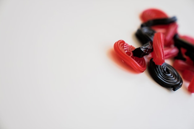 Free photo red and black licorice with copy space