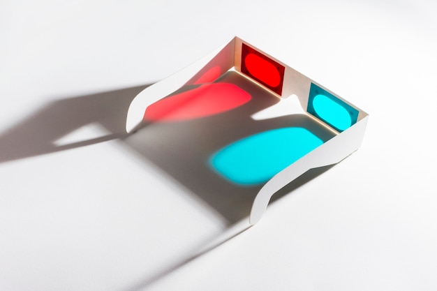 Free Photo red and blue 3d glasses on reflective background