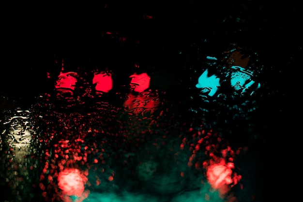 Free Photo red and blue lights reflecting through the body of water at nighttime