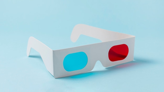 Red and blue white paper 3d glasses on blue background