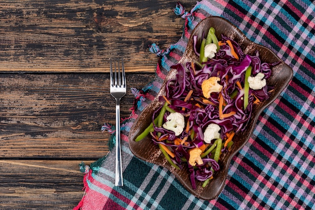 red cabbage salad on color cloth top view