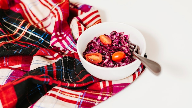 Free Photo red cabbage and tomatoes in bowl on table