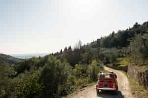 Free photo red car on country road