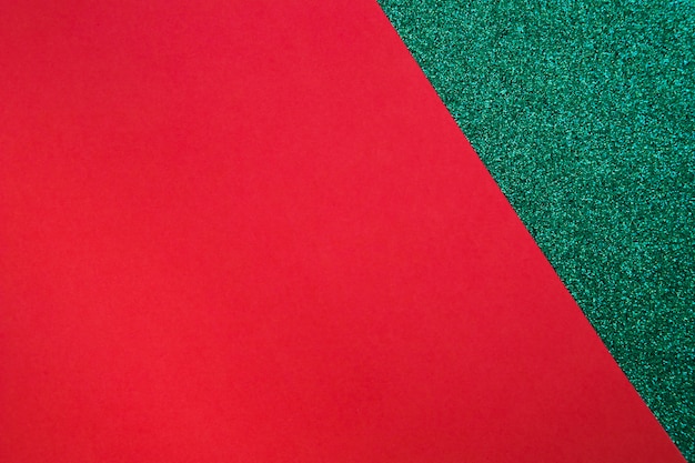 Red cardboard paper on green surface