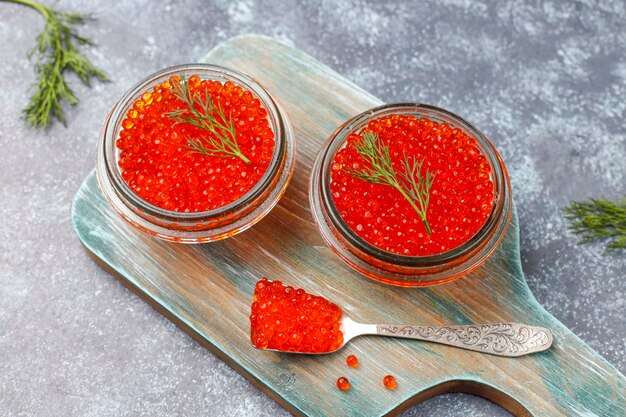 Red caviar in glass bowl and in a spoon