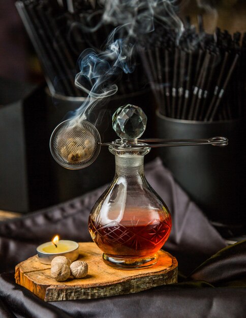 Red composto in a glass jar and aroma steam.