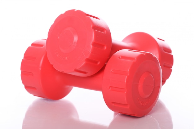 Free Photo red dumbbells over white