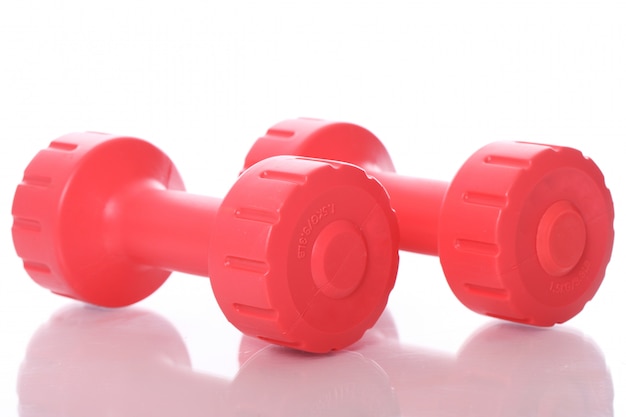 Free Photo red dumbbells over white