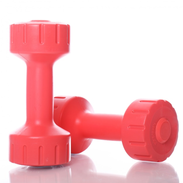 Free Photo red dumbbells over white