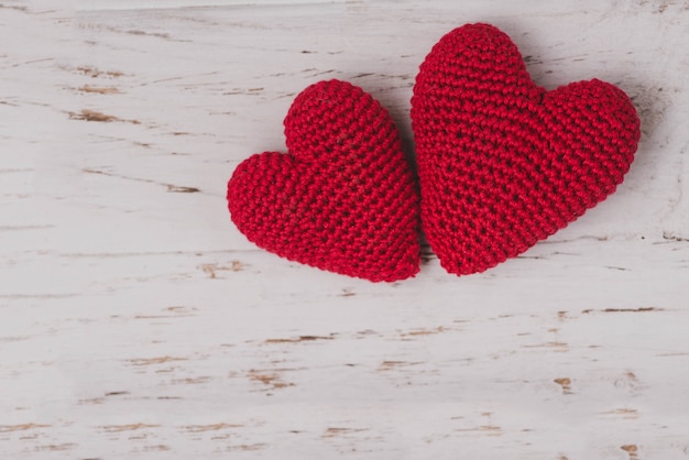 Free Photo red fabric hearts on a white background