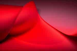 Free photo a red fabric with a curved edge is shown in a red background.