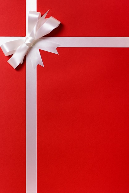 Free photo red gift paper with silver ribbon