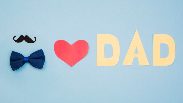 Red heart and dad title near bow tie and mustache