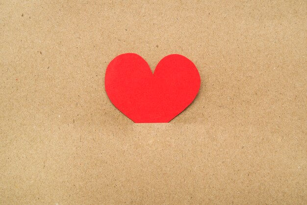 Red heart in middle of cardboard