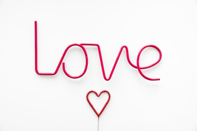 Free photo red heart near love writing