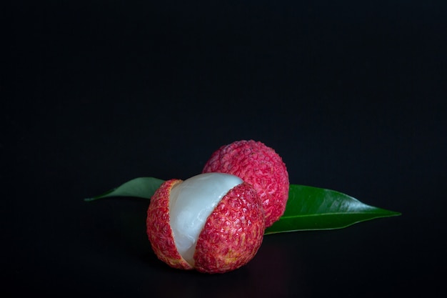 Free Photo red lychee fruit placed in a basket.