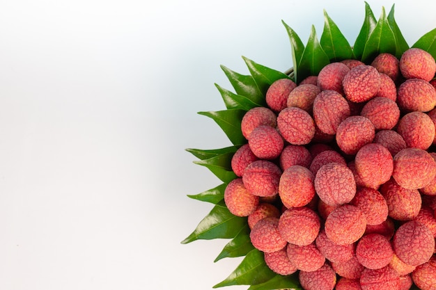 Red lychee fruit placed in a basket