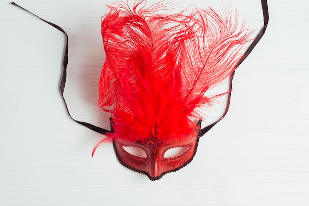 Free Photo red mask with feathers