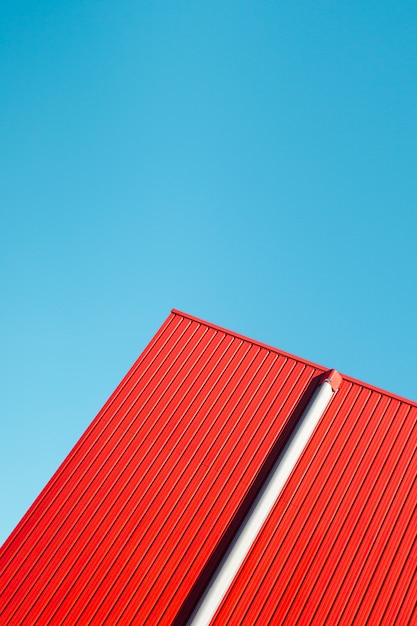 Red metallic wall with sky