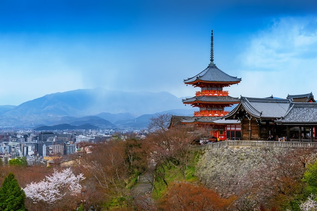 Red pagoda and Kyoto cityscape in Japan.