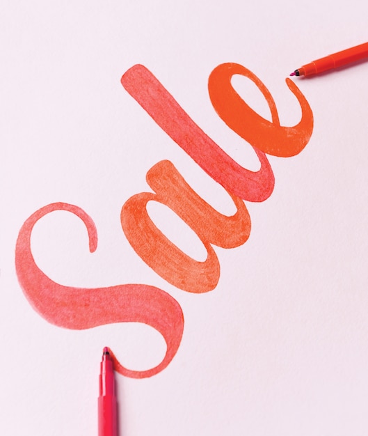 Red painted lettering SALE