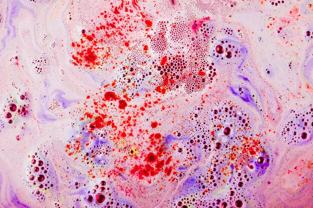 Red and purple textured surface with dissolve bathbomb