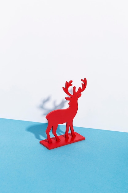 Free photo red reindeer decor with shadows