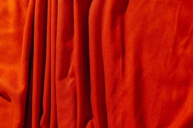 Red scarf over black wood table background