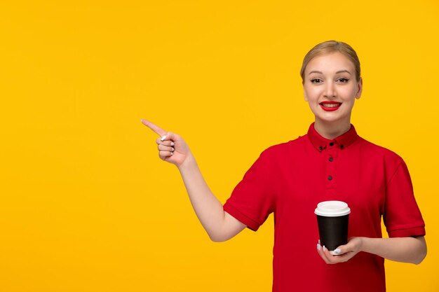 Red shirt day lovely lady holding coffee take away cup in a red shirt on a yellow background