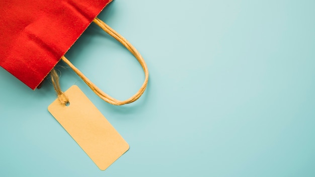 Free Photo red shopping bag on table 