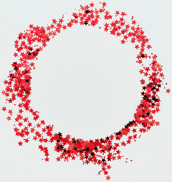 Red stars confetti round frame