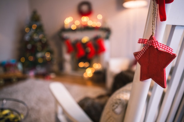 Red stars hanging from a white armchair