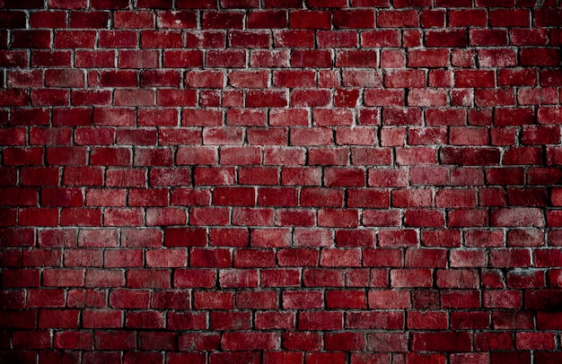 Free photo red textured brick wall background