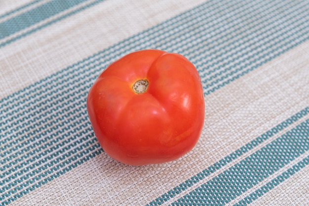 Red tomato on the table