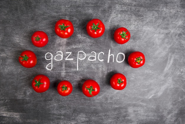 Free photo red tomatoes on wooden grey table