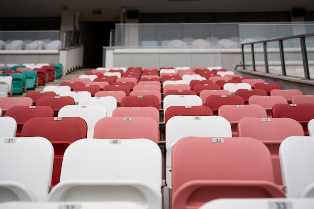 Red and white grandstands at arena low angle