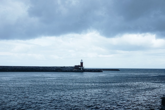 Red and white lighthouse scenery