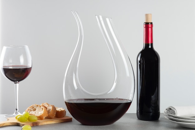 Free photo red wine bottle and carafe