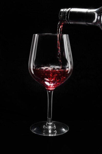 Red wine pouring into a wine glass