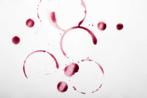 Red wine stains on white textile