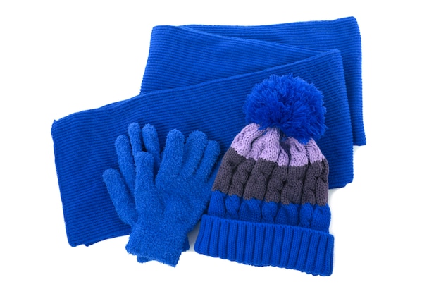 Free Photo red winter knitted bobble hat, scarf and gloves isolated on a white background