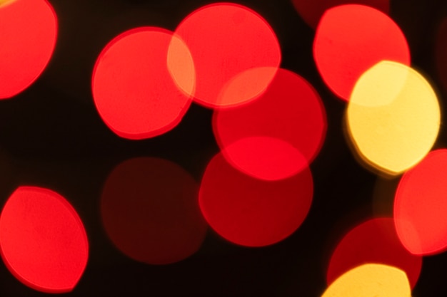 Red and yellow bokeh lights on a dark background