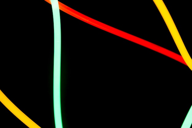 Free photo red; yellow and green neon tubes on black background