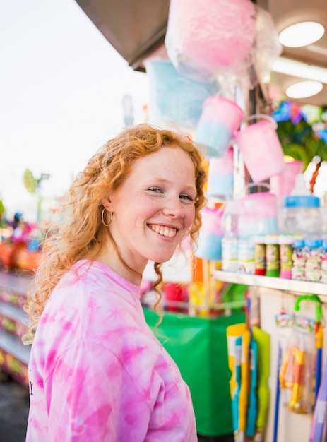 Free photo redhead at funfair looking at camera