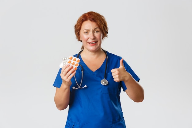 Redhead middle-aged nurse posing