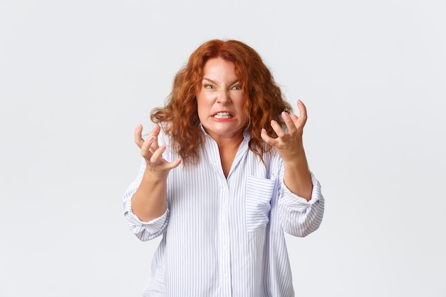 Redhead middle-aged woman posing