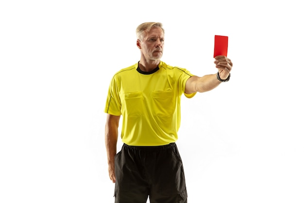 Referee showing a red card to a displeased football or soccer player while gaming isolated on white wall.