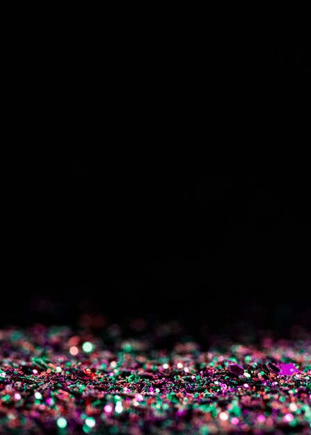 Free Photo reflective multicolored glitter with copy space