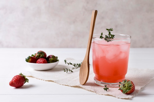 Refreshing alcoholic drink with strawberry